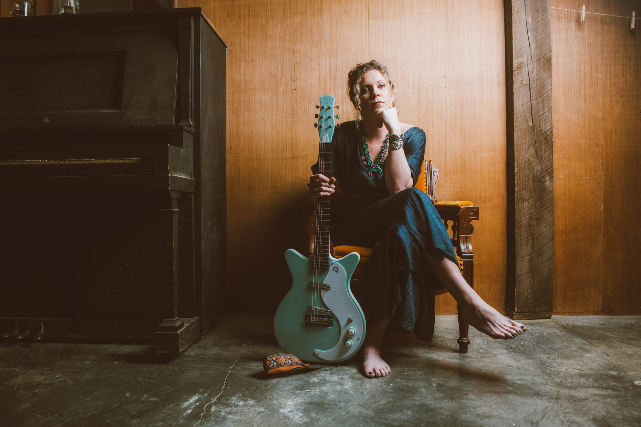 Nicole Lund Seated with guitar